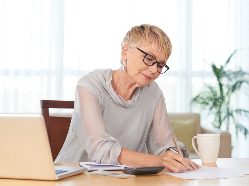 Woman counting expenses Woman counting expenses